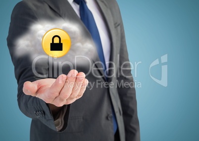 Business man mid section with cloud and yellow lock graphic in hand against blue background