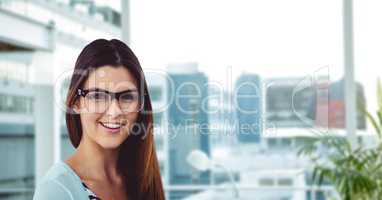 Young woman wearing eyeglasses in office