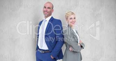 Portrait of confident business people standing against gray background