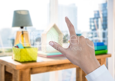 Hand pointing in air of colourful office