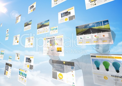 panels with websites(yellow) in the sky in front of a man doing things on it