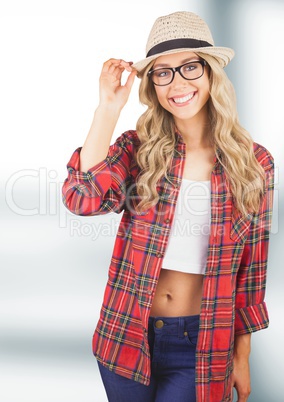 Portrait of happy female hipster wearing sun hat and plaid shirt