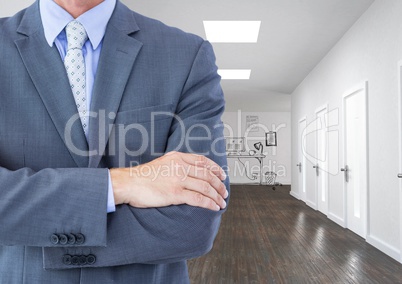 Midsection of businessman with arms crossed