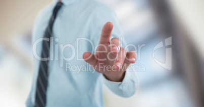 Midsection of businessman pointing screen