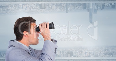 Businessman using binoculars against upside down city