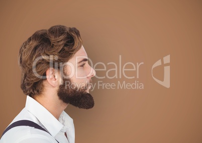 Side view of hipster with beard over brown background
