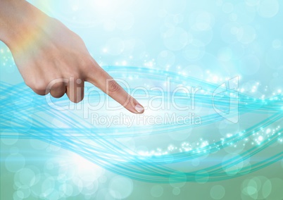Hand pointing in  air of sparkling magical abstract lights