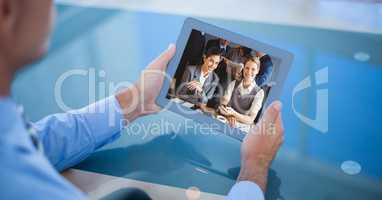 Businessman video conferencing on tablet PC