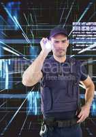 Security guard using flashlight against abstract background