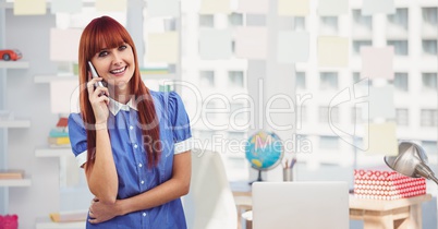 Female hipster using mobile phone in office