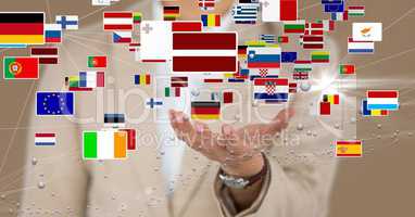 Midsection of business executive with various flags