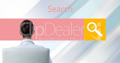 Rear view of businesswoman sitting against search screen