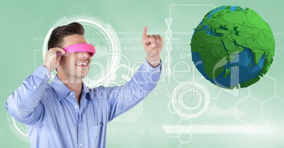 Businessman wearing VR headphones while gesturing by low poly earth