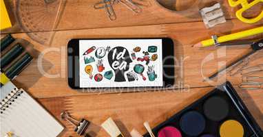 Idea icons on smart phone by stationery