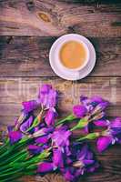 bouquet of irises and a cup of coffee