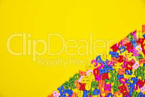 Abstract yellow background with multicolored letters