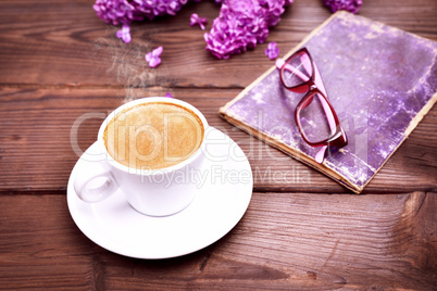 Cup of espresso on a brown table