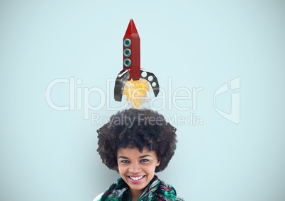 Smiling woman with rocket over head