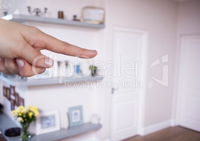 Hand touching air with living room