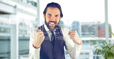 Angry male hipster clenching teeth in city