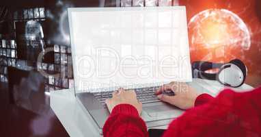 Digital composite image of hacker using laptop with blank screen