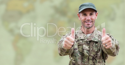 Soldier thumbs up against blurry map with green overlay