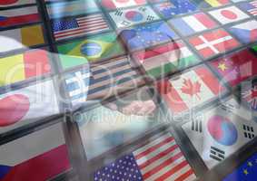 panel with flags black and white men shaking the hand each other