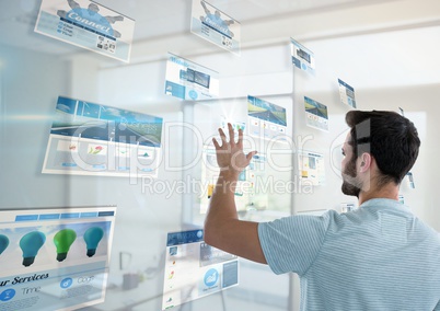 panels with websites(blue) in a office, young man