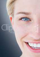 Close up of half woman's face against navy background