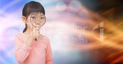 Portrait of girl looking through magnifying glass over bokeh