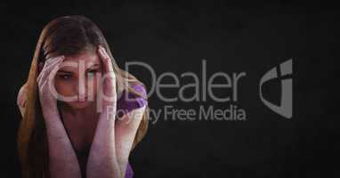 Woman with hands around head against black background with grunge overlay