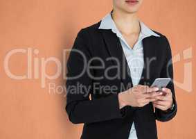 Midsection of businesswoman holding smart phone