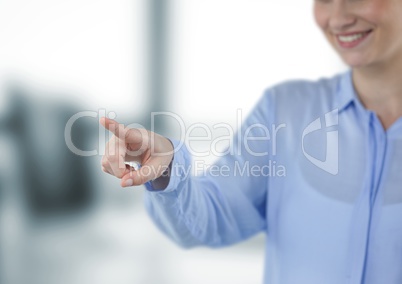 Midsection of smiling businesswoman touching imaginary screen