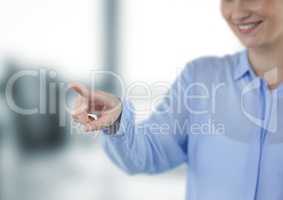 Midsection of smiling businesswoman touching imaginary screen