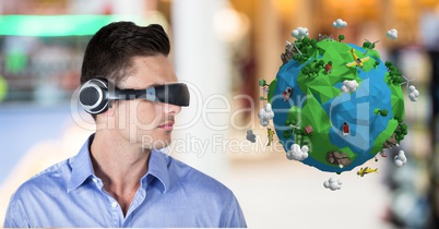 Businessman wearing VR headphone by low poly earth