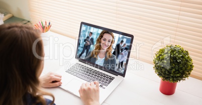 Cropped image of businesswoman video conferencing on laptop