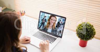 Cropped image of businesswoman video conferencing on laptop