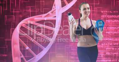 Smiling young woman holding exercise mat and water bottle by DNA structure