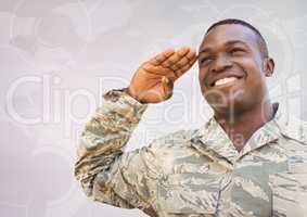 Soldier smiling and saluting against white map with interface