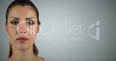 Woman's face after crying against light blue background