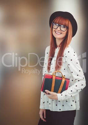 Happy female hipster holding diaries