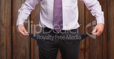 Midsection of businessman showing empty pockets