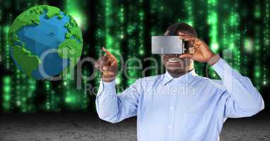 Smiling businessman touching low poly earth while using VR glasses