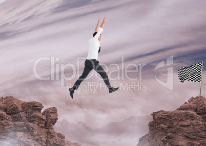 businessman jumping with his hands up to catch the checker flag