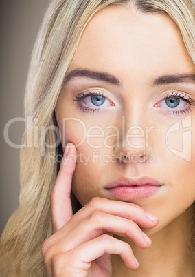 Close up of woman thinking against brown background
