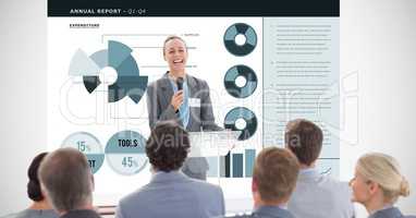 Happy businesswoman giving presentation with graphs in background