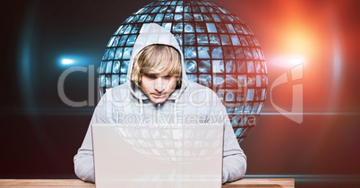 Hacker using laptop against globe