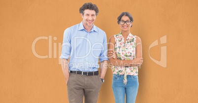 Portrait of confident business people standing against orange background