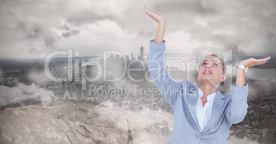 Tensed businesswoman gesturing against landscape