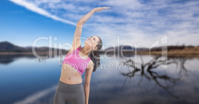 Double exposure of woman performing yoga at lakeshore